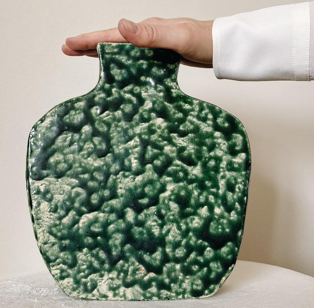 Sculptural ceramic vase with rich, textured glaze Vintage sculptural ceramic vase with unique rough texture and gradient deep forest green glaze, Mid-Century Modern abstract pottery vase, art object.
